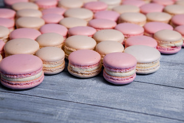 Close up colorful macarons dessert with vintage pastel tones French colorful macarons background, close up macaron or macaroons cookie, tasty dessert. food background