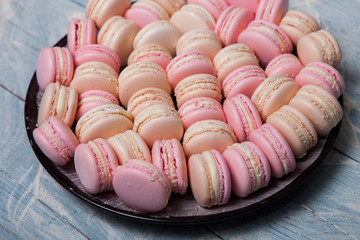 macaron or macaroons cookie, tasty dessert. food background Plate of fresh colorful macarons. 