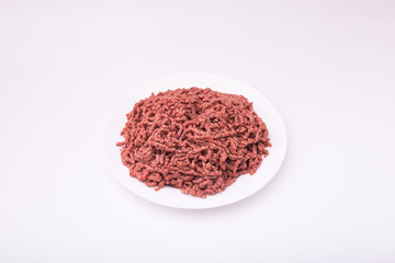 Top view of raw minced beef meat isolated on white