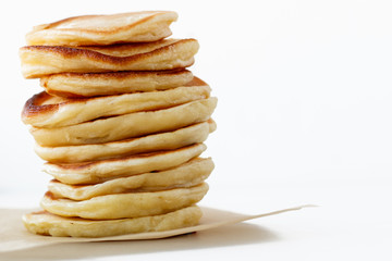 Stack of plain pancakes оn white background with free space for design and text