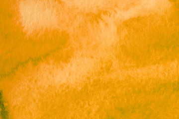 orange watercolor blot on white background