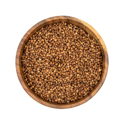 Raw buckwheat in a wooden plate isolated on white background