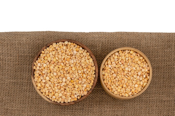 Raw yellow split plate on a burlap texture background