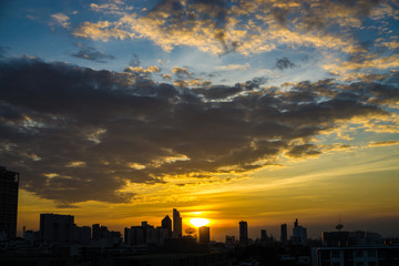 Fototapeta na wymiar Sunrise sky silhouette city building