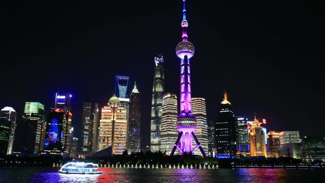 View Of Shanghai Skyline At Night. Huangpu river, Oriental Pearl Tower And City Skyline.