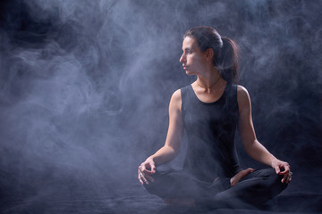 Fototapeta na wymiar young woman doing yoga