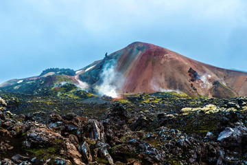 Brennisteinsalda Volcano mountain and its active fumaroles and solfataras in Landmannalaugar seen from the lava field at summer midnight. Iceland Highlands