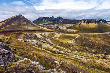 Volcanic Landscape of Landmannalaugar region in Iceland Highlands viewed from Frostastadavatn lake. Nordurnamur mountain is at left.