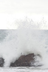 Wave splash on island rocks