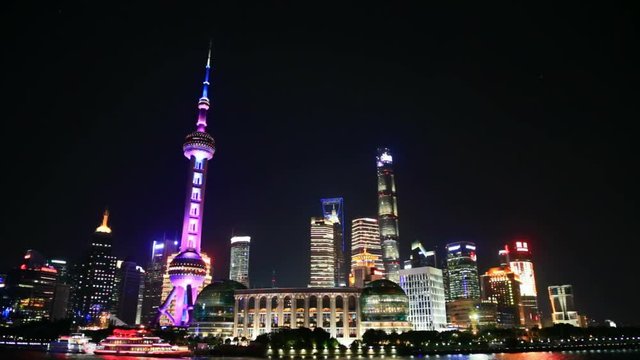 View Of Shanghai Skyline At Night. Huangpu river, Oriental Pearl Tower And City Skyline.