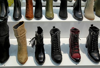 Background with shoes on shelves of shop