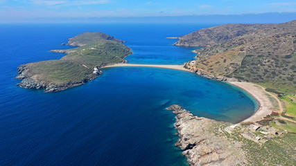 Aerial drone panoramic photo of iconic two sided sandy tropical turquoise sea paradise beach of Kolones near Fykiada in island of Kythnos at spring, Cyclades, Greece