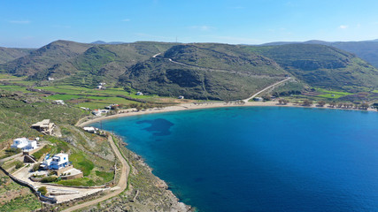 Naklejka premium Aerial drone photo of iconic two sided sandy tropical turquoise sea paradise beach of Apokrisi near Fykiada in island of Kythnos at spring, Cyclades, Greece