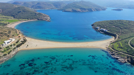 Naklejka premium Aerial drone panoramic photo of iconic two sided sandy tropical turquoise sea paradise beach of Kolones near Fykiada in island of Kythnos at spring, Cyclades, Greece