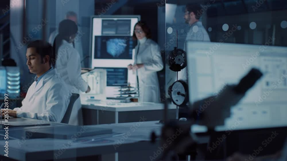 Poster in technology research laboratory: diverse team of industrial scientists, engineers, developers gath