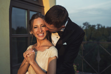 young couple in front of modern building