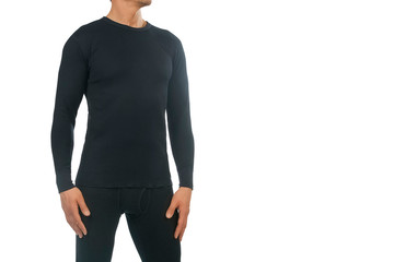Man in thermal underwear for active winter sport. Man wearing Thermolinen isolated on white background. T-shirt with long sleeves and leggings