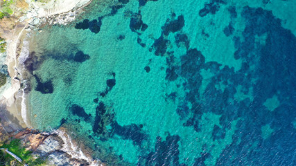 Aerial drone photo of tropical caribbean bay with white sand beach and beautiful turquoise and sapphire clear sea