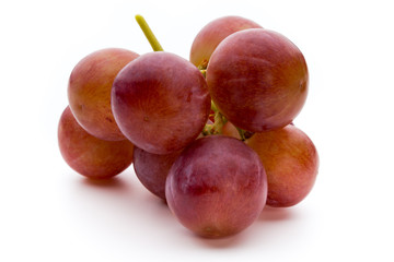 Ripe red grape isolated on white.
