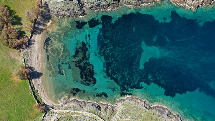 Aerial drone photo of tropical caribbean bay with white sand beach and beautiful turquoise and sapphire clear sea