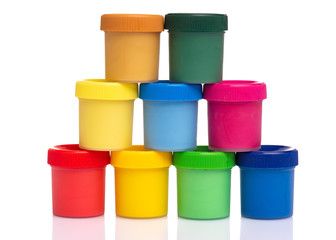 Set of Colorful Gouache jars isolated on white background with copy space. Cans of different colors gouache paints.