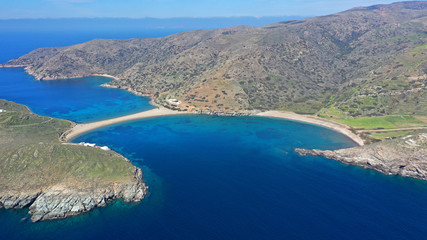 Aerial drone panoramic photo of iconic two sided sandy tropical turquoise sea paradise beach of Kolones near Fykiada in island of Kythnos at spring, Cyclades, Greece
