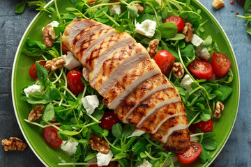 Fresh Grilled Chicken salad with tomatoes, feta cheese and vegetables