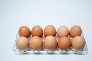 Close up of chicken eggs over white background