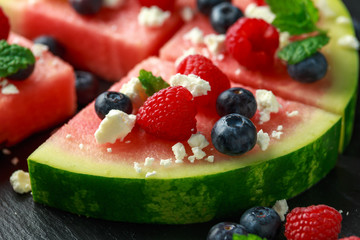 Juicy watermelon pizza with blueberries, raspberry feta cheese, mint. party food