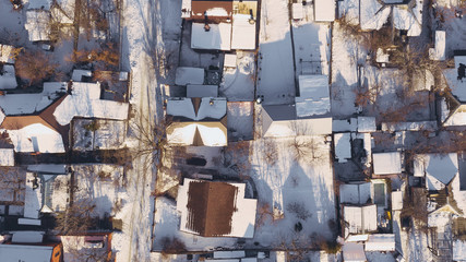 Aerial top view from drone on city rooftops patio with snow. (Dnipro, Dnepr, Dnepropetrovsk, Dnipropetrovsk). Ukraine