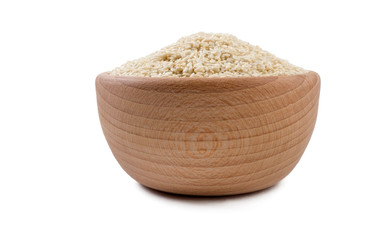 sesame seeds in wooden bowl isolated on white background. Spices and food ingredients.