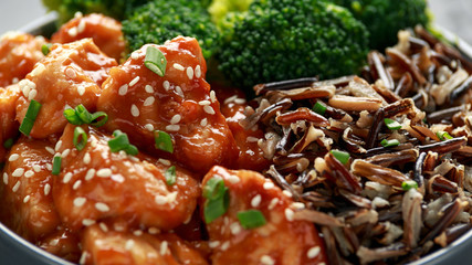 Teriyaki chicken, steamed broccoli and wild rice served in bowl
