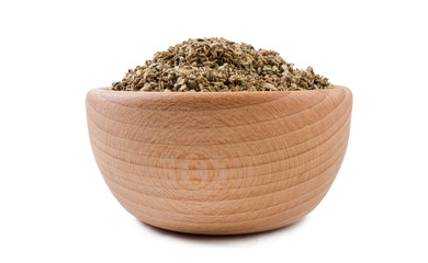 Fototapeta na wymiar salvia or sage in wooden bowl isolated on white background. Spices and food ingredients.