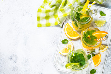 Lemonade, mojito and orange lemonade on white.