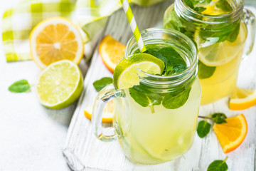 Lemonade, mojito and orange lemonade on white.
