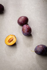 Organic plums on concrete