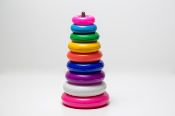 Pyramid with different colors for children, white background.