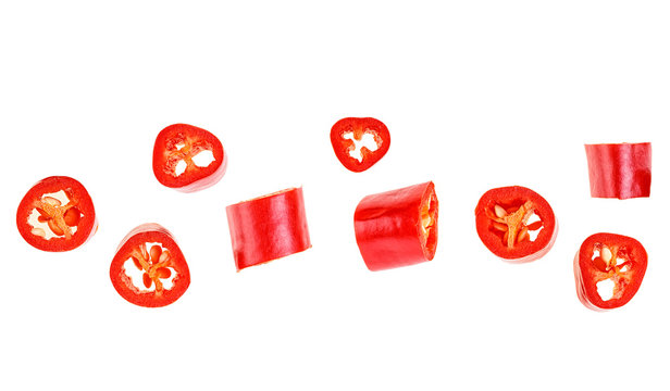 Red chopped chili peppers on white background. Top view.