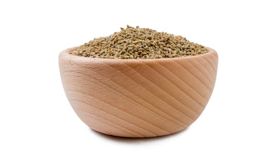 anise seeds in wooden bowl isolated on white background. Spices and food ingredients.