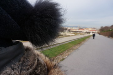 Woman wearing a fur wool hat outside