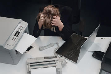 Stressed tired businesswoman feels exhausted sitting at office desk with laptop, frustrated woman...