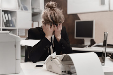 Stressed tired businesswoman feels exhausted sitting at office desk with laptop, frustrated woman...