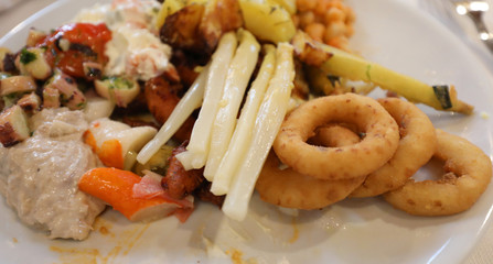foods including onion rings and asparagus and fish surimi