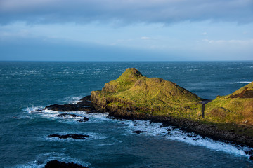 Fototapeta na wymiar Green cliff in the oceans