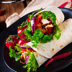 Tasty wraps filled with pulled pork and salad