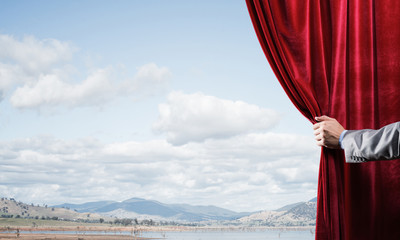 Summer natural bluesky view behind red velvet curtain