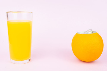 Orange juice on pink background