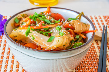 Spicy Asian salad of pickled Chinese cabbage, tomatoes, pepper, green onions and sesame. Kimchi...