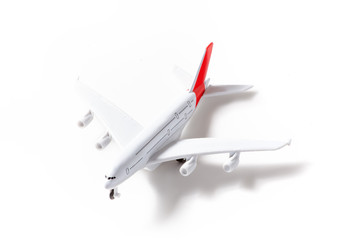 Toy airplane isolated on white. Travel and technology concept