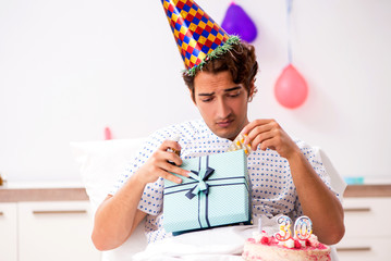 Young man celebrating his birthday in hospital